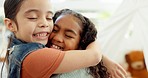 Family, friends or children hug at home for love, care and happiness while playing together. Happy multiracial girls, kids and siblings or sisters rub noses for fun, quality time and bonding