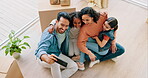 Happy family, real estate and laughing in new home for selfie, photo or memory together above at apartment. Father, mother and children taking picture or photograph by box in relocation or renovation