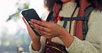 Hiking, phone and woman hands in nature for travel, search location and scroll social media or trekking blog. Information, connection and camper or person with mobile, internet and website in forest