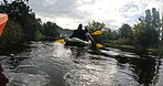 Kayak, travel and people on a boat in the lake while on a vacation or weekend trip for adventure. Nature, freedom and friends rowing on a river for water sports while on a holiday in forest or woods.