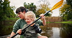 Kid, mother rowing and kayak in lake on holiday, vacation and travel together. Mom, child and girl in canoe, boat and bonding in river, water and fitness exercise on adventure with family outdoor.