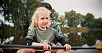 Mother, girl and rowing kayak in lake on holiday, vacation and travel together. Mom, child and kid in canoe, boat and bonding in river, water and fitness exercise on adventure with family outdoor.