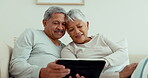 Senior couple, relax and tablet on sofa in home living room for love, movies and streaming internet show. Happy woman, elderly and talking man on technology for media choice, bonding or website app