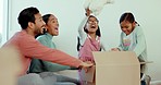 Mother, father and children in new home with box, toys or happy celebration for fresh start at property. Parents, girl kids and moving with cardboard package, excited together or play in family house