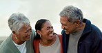 Laughing, beach and woman with her senior parents on a family, tropical and island holiday. Comic, funny and happy elderly couple in a comedy conversation with adult daughter on a vacation by ocean.