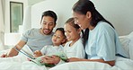 Family, reading and parents and children with book in bed for story time, child development and learning. Happy, relax and mom, father and kids laying with novel for fantasy, storytelling and bonding