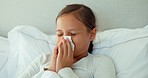 Girl kid, tissue and blowing nose in home for cold, allergies and risk of medical virus. Face, sick young child and sneezing for health problem, sinusitis allergy and infection of disease in bedroom