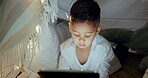 Tablet, child reading on screen and streaming a game, movie or cartoon at night in bedroom, home or watching tv show online. Girl, typing a search and mobile app for movies, games or anime for kids