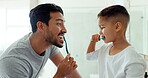 Dad, child and brushing teeth in bathroom for dental grooming, morning routine together or healthy learning. Family of father, boy kid and cleaning mouth with toothbrush for self care of fresh breath