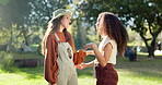 Friend, girls and hug at camp in outdoor with conversation on vacation in environment. Women and together in nature with tent in countryside with embrace on holiday or talking for travel with smile.