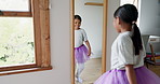 Ballet, girl and child dancer dancing in a mirror to practice, happy and training for performance in her bedroom. Home, smile and young creative kid after a lesson enjoy music with happiness