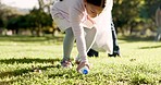 Cleaning, recycling and child in park with litter for community service, volunteering and sustainability. Eco friendly, charity work and girl with bag for picking trash, plastic and garbage in nature