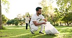 Cleaning, volunteer and man in park with litter for community service, recycling and sustainability. Eco friendly, charity work and male person with bag for trash, plastic and pollution in nature