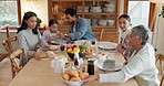 Relax, food and love with big family at table for breakfast, nutrition and dinner. Happiness, health and support with parents and child in dining room at home for wellness, helping and lunch together