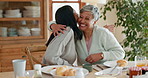 Hug, breakfast and women talking in a family home with food at table for health and wellness. A mother, people or friends together in dining room with love, care and conversation about relationship