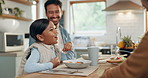 Parents, children and a girl eating spaghetti with her family in the dining room of their home together for supper. Food, kids and father around a table for a meal, bonding over dinner in a house