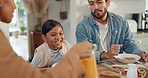 Happy, family and lunch with juice at a table, hungry and a child excited for a drink. Smile, interracial and a mother, father and girl kid eating and enjoying dinner or breakfast together in a home