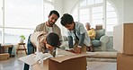 Moving, help and children packing with dad, support and care in an apartment and boxes together. Real estate, happy and a father teaching boy kids to pack in the living room for home relocation