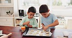 Baking, learning and kids with food ingredients in a home with cookies for cooking in kitchen. Children, helping and flour for youth in a house with support and sibling care from family with love