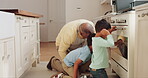 Oven, children and grandfather cooking in the kitchen together while waiting for the food to be ready. Family, kids and a senior man teaching his grandchild about baking or meal preparation at home