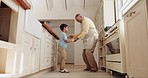 Dance, kitchen and elderly man with his grandchild having fun, bonding and listening to music. Happy, smile and grandfather moving with a boy kid to a playlist, radio or song while cooking in a home.