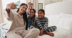 Selfie, happy and family in home bedroom, bonding and having fun together. Profile picture, smile and parents with kids, interracial mother and father taking photo for social media after adoption.