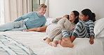 Relax, happy and love with family in bedroom for wake up, support and playful. Happiness, peace and morning with parents and children in bed at home for free time, conversation and bonding