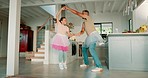 Dad, girl and ballet with dancing, home and tutu with playing, care and bonding together in kitchen. Happy father, young daughter or ballerina with comic game, art and creativity in family house