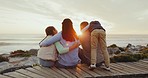 Parents, kids and back at beach, sunset and watch together with hug, love and bonding on vacation in nature. Mom, dad and children with care, view and relax by ocean for holiday, adventure or freedom