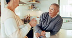 Old couple, talk in kitchen with coffee and retirement, bonding with love and communication, laughter and happiness. Pension, funny story and man with woman at home, conversation and morning routine