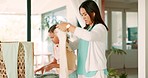 Laundry, child and mother fold clothes, doing house work and prepare clean fabric, cotton or home linen. Table, support and family kid helping mom with fresh shirt and doing domestic housekeeping