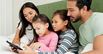 Mother, father and children on bed with a tablet in a family home for education, games and learning. A man, woman and girl kids in a bedroom together with technology for internet, streaming or movies