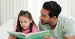 Father, child and reading a book in a family home for learning, development or quality time. A man and girl kid relax in a bedroom for a story, education or teaching language with love and care
