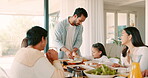 Kids, parents and grandparents at thanksgiving dinner together as a family eating food for bonding in celebration. Love, brunch and children with relatives in a dining room during the holidays