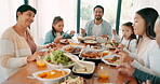 Children, parents and grandparents eating at thanksgiving together as a family for bonding in celebration. Love, lunch or brunch food with kids and relatives at the dining room table during a holiday