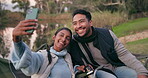 Couple, smile and camping selfie in nature for social media, travel blog and holiday by lake, forest or woods. Happy, interracial woman and man with photography for memory, relax or camper experience