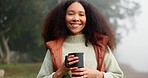 Portrait of happy woman with coffee, nature and camping on winter adventure, peace and calm. Relax, freedom and girl with smile on face, cup in forest and hiking in trees, travel and holiday in woods