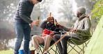 Men, camping group and toast beer with chair, relax and happy for celebration, party and adventure in woods. Student friends, alcohol drink and diversity for conversation, smile and cheers in forrest