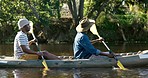 Lake, camping and men in kayak together, summer adventure and nature for sports, fun and hobby. Rowing in boat, canoe and friends on river with view of trees, water and freedom on outdoor vacation.