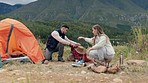 Couple, camping and help with tent at river for vacation, holiday and travel outdoor. Campsite, lake and man and woman set up in nature together for adventure, hiking and trekking in the countryside.