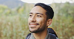 Hiking, smile and a man breathing fresh air outdoor in nature for freedom, travel or peace in the wilderness closeup. Face, walking and inhale with a happy young male hiker in the woods or forest