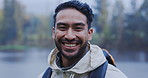 Face, hiking and funny with a man laughing outdoor in nature on a cold winter morning for travel. Portrait, freedom and adventure with a handsome young male hiker in the wilderness for tourism