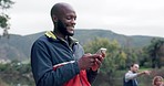 African man, forest and phone with texting, reading and funny meme for camping, adventure or holiday. Gen z guy, smartphone and happy for comic video, web chat or post on social network app in woods