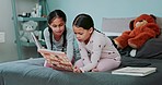 Sisters, kids and book for reading on bed, teaching or education for help, care and love in family home. Girl child, young siblings and learning for literacy, language and advice with story in house