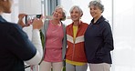 Senior friends, phone and picture in home after exercise, workout or fitness. Elderly women, group and photography of happy people together after training for healthy body, wellness and retirement