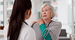 Healthcare, shoulder pain and a woman with her doctor in the hospital, talking during a consultation. Medical, insurance or anatomy and senior female patient in a clinic with a medicine professional