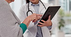 Woman, hands and talking with doctor or tablet at clinic for online app with information. Consultation, patient and medical professional holding tech for research or discussion about healthcare.