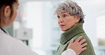 Medical, shoulder pain and an old woman with her doctor in the hospital, talking during a consultation. Healthcare, insurance or anatomy and a senior patient in a clinic with a medicine professional