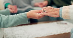 Woman, holding hands and support group for elderly care or trust for unity, community or social gathering at home. Closeup of women touching hand in teamwork activity, understanding or collaboration