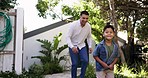 Father, family and playing in garden with young boy having fun with bonding outdoor. Dad, kid and backyard running in new real estate and property feeling happy and excited with a smile in summer